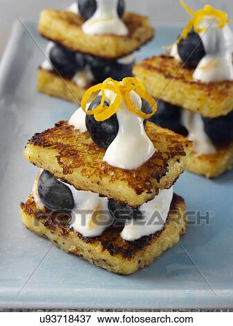Stock Photo - Baby French toast with creamy blueberry stuffing. Fotosearch