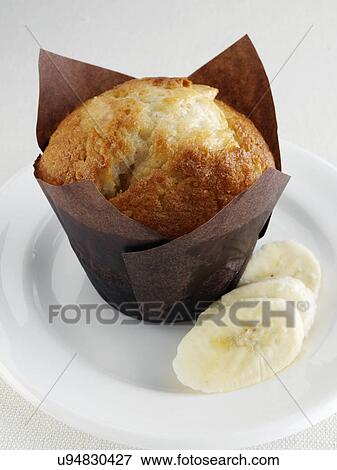 Banana muffin with fruit on a white plate View Large Photo Image Stock Photo - Banana muffin with fruit on a white plate. Fotosearch