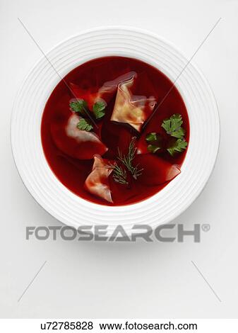 Stock Photo - Beetroot soup with pierogi dumplings. Fotosearch
