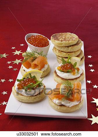 Blini with smoked salmon salmon roe and cream cheese View Large Photo Image Stock Image - Blini with smoked salmon salmon roe and cream cheese. Fotosearch