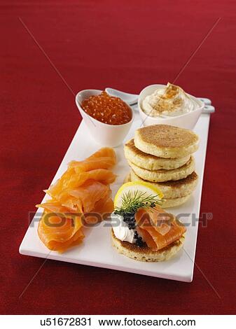 Blini with smoked salmon salmon roe and cream cheese View Large Photo Image Stock Image - Blini with smoked salmon salmon roe and cream cheese. Fotosearch