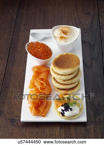 Blini with smoked salmon salmon roe and sour cream View Large Photo Image Stock Image - Blini with smoked salmon salmon roe and sour cream. Fotosearch