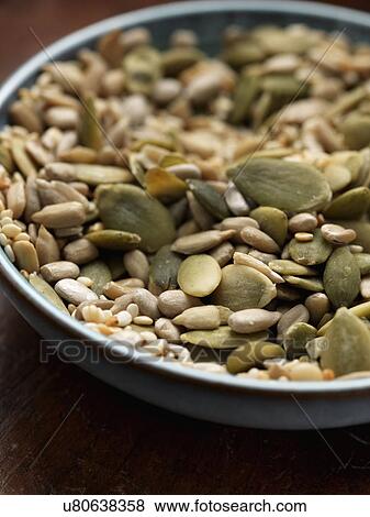 Stock Photo - Blue bowl of seeds. Fotosearch