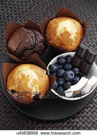 Blueberry chocolate coconut muffins with fruit and chocolate pieces View Large Photo Image Stock Photograph - Blueberry chocolate coconut muffins with fruit and chocolate pieces. Fotosearch