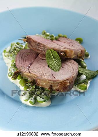Boned roast leg of lamb slices with creamy peas and broad beans View Large Photo Image Stock Image - Boned roast leg of lamb slices with creamy peas and broad beans. Fotosearch