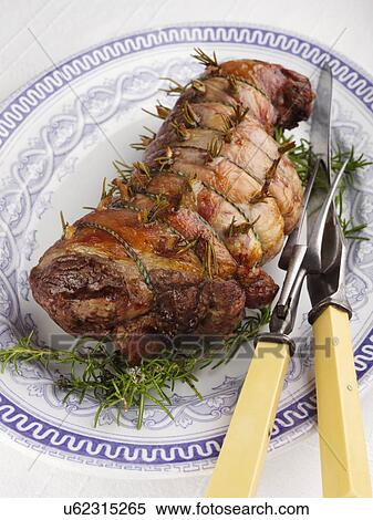 Boned roast leg of lamb slices with creamy peas and broad beans View Large Photo Image Stock Photography - Boned roast leg of lamb slices with creamy peas and broad beans. Fotosearch