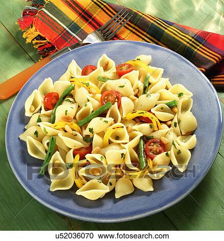 Stock Image - Bowl Of Homemade Conchigle With Herb Salad. Fotosearch