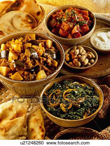 Bowls Of Eggplant And Potato Curry With Spinach And Onion Curry, Sweet Potatoes, Naan Bread And Pompadoms View Large Photo Image Stock Image - Bowls Of Eggplant And Potato Curry With Spinach And Onion Curry, Sweet Potatoes, Naan Bread And Pompadoms. Fotosearch