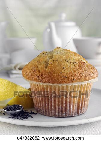 Breakfast lemon and poppy seed muffin with leon wedges and tea set View Large Photo Image Stock Image - Breakfast lemon and poppy seed muffin with leon wedges and tea set. Fotosearch