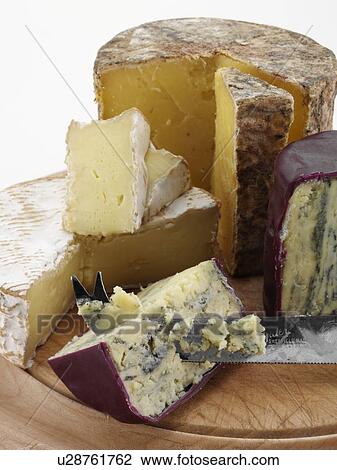 British cheeses on cheese board Cheddar Tunworth and baby Stilton View Large Photo Image Stock Image - British cheeses on cheese board Cheddar Tunworth and baby Stilton. Fotosearch