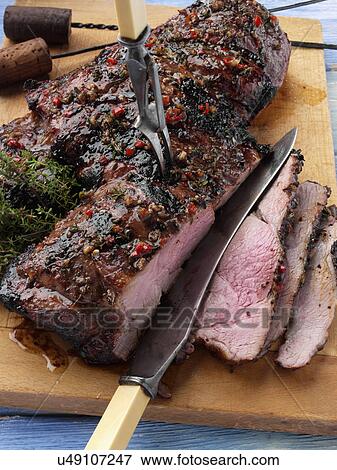 Butterflied leg of lamb marinaded and barbecued View Large Photo Image Stock Photo - Butterflied leg of lamb marinaded and barbecued. Fotosearch