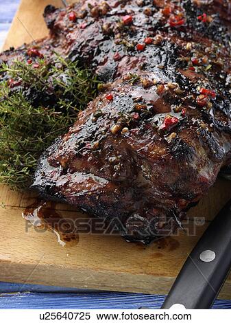 Butterflied leg of lamb marinaded and barbecued View Large Photo Image Stock Photography - Butterflied leg of lamb marinaded and barbecued. Fotosearch