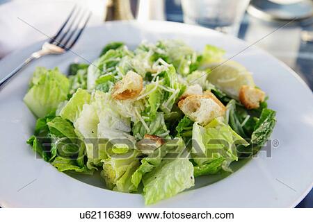 Caesar Salad In White Bowl, Made With Romaine Lettuce, Parmesan And Croutons View Large Photo Image Stock Photo - Caesar Salad In White Bowl, Made With Romaine Lettuce, Parmesan And Croutons. Fotosearch
