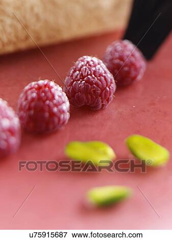 Cake decoration raspberries pistachios View Large Photo Image Stock Photo - Cake decoration raspberries pistachios. Fotosearch