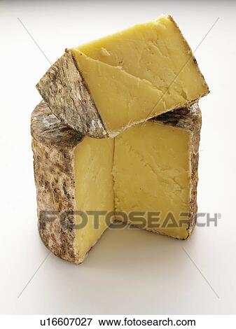 Cave aged traditional cloth wrapped mature cheddar cheese View Large Photo Image Stock Photo - Cave aged traditional cloth wrapped mature cheddar cheese. Fotosearch