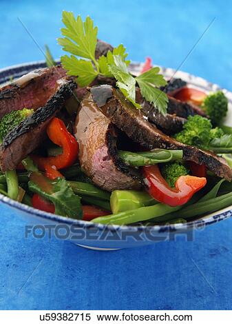 Chargrilled fillet steak strips with vegetable salad honey vinigarette dressing View Large Photo Image Stock Photography - Chargrilled fillet steak strips with vegetable salad honey vinigarette dressing. Fotosearch