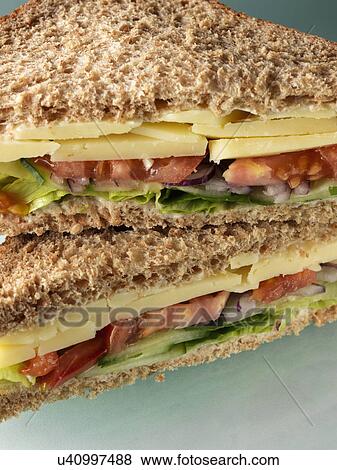 Cheese sandwich with tomato lettuce cucumber View Large Photo Image Stock Photo - Cheese sandwich with tomato lettuce cucumber. Fotosearch