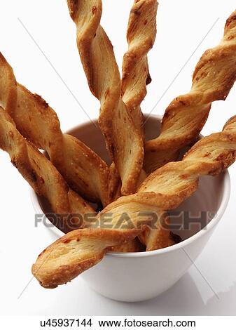 Cheese twists straws on a white background View Large Photo Image Picture - Cheese twists straws on a white background. Fotosearch