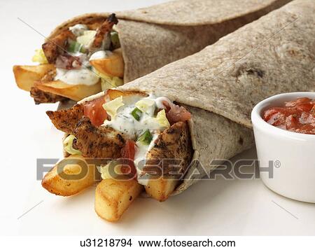 Chicken chapatti wraps with chips fusion food View Large Photo Image Picture - Chicken chapatti wraps with chips fusion food. Fotosearch