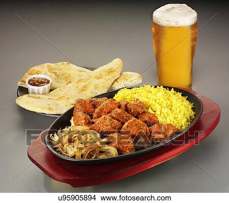 Chicken Tikka Meal With Fried Rice And Pilau Rice, Naan Bread And Relish. Pint Glass Of Lager Beer View Large Photo Image Picture - Chicken Tikka Meal With Fried Rice And Pilau Rice, Naan Bread And Relish. Pint Glass Of Lager Beer. Fotosearch