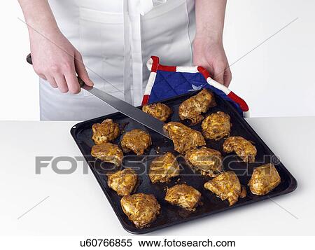 Stock Photography - Chicken tikka on a baking sheet. Fotosearch