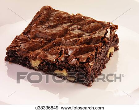 Stock Photo - Chocolate And Pecan Brownie On White. Fotosearch
