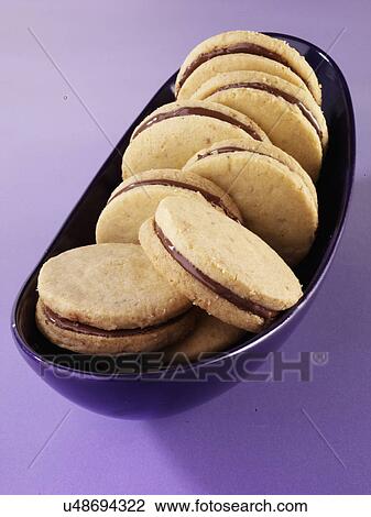 Chocolate Filled Cookies In Purple Dish On Purple Tabletop View Large Photo Image Stock Image - Chocolate Filled Cookies In Purple Dish On Purple Tabletop. Fotosearch