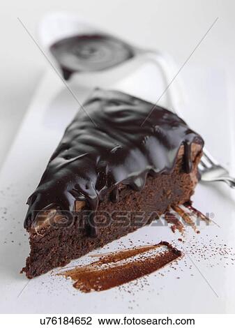 Stock Image - Chocolate fudge cake slice. Fotosearch
