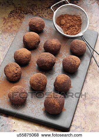 Stock Photo - Chocolate truffles dusted with cocoa powder. Fotosearch