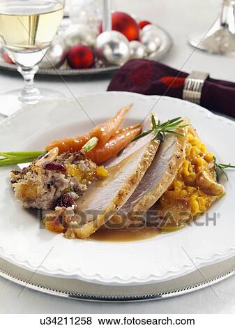 Stock Photo - Christmas dinner turkey stuffing carrots and mashed sweet potato. Fotosearch