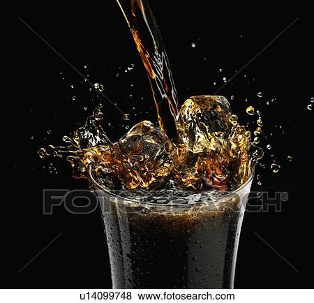 Coca Cola splashing into a glass with ice View Large Photo Image Stock Photo - Coca Cola splashing into a glass with ice. Fotosearch