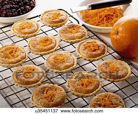 Cooked Mini Orange Bakewell Tarts On Cooling Tray View Large Photo Image Stock Photo - Cooked Mini Orange Bakewell Tarts On Cooling Tray. Fotosearch