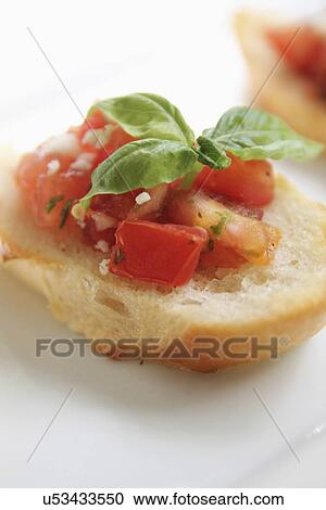 Crostini Topped With Tomato And Garlic View Large Photo Image Stock Image - Crostini Topped With Tomato And Garlic. Fotosearch