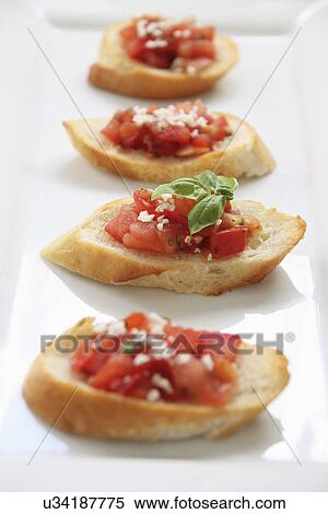 Crostini Topped With Tomato And Garlic View Large Photo Image Stock Photography - Crostini Topped With Tomato And Garlic. Fotosearch