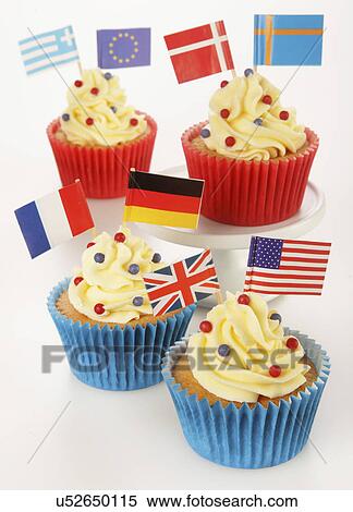 Stock Photography - Cupcakes With Buttercream Topping Decorated With International World Flags, Red And Blue Cake Cases, On White. Fotosearch