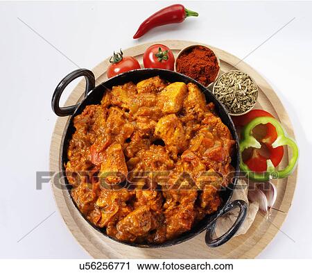 Dish Of Chicken Balti Curry On Wooden Board With Tomatoes, Sliced Green Pepper, Dried Spices And Red Chilli, Overhead On White View Large Photo Image Stock Image - Dish Of Chicken Balti Curry On Wooden Board With Tomatoes, Sliced Green Pepper, Dried Spices And Red Chilli, Overhead On White. Fotosearch