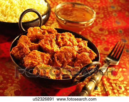 Stock Image - Dish Of Chicken Balti Curry With Pilau Rice And Mango Chutney. Fotosearch