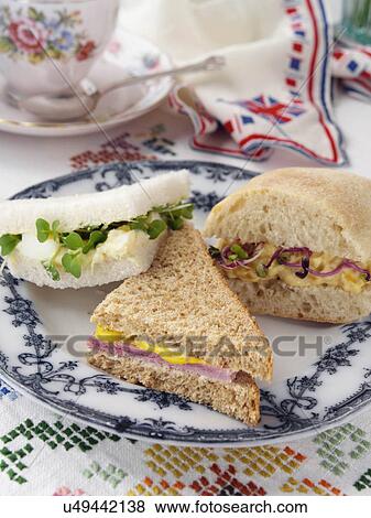 Egg mayo on white ham on wholemeal and coronation chicken in ciabatta with radish sprouts View Large Photo Image Stock Photo - Egg mayo on white ham on wholemeal and coronation chicken in ciabatta with radish sprouts. Fotosearch