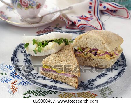 Stock Photo - Egg mayo on white ham on wholemeal and coronation chicken in ciabatta with radish sprouts. Fotosearch