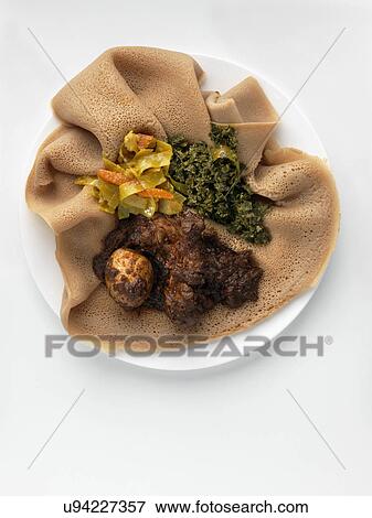 Stock Photo - Ethiopian Christmas dinner. Fotosearch