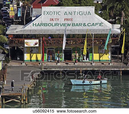 Exterior Of Harbour Bar And Cafe With Jetty, Small Boat And Water, St. John'S Antigua View Large Photo Image Stock Photography - Exterior Of Harbour Bar And Cafe With Jetty, Small Boat And Water, St. John'S Antigua. Fotosearch
