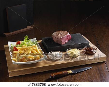 Stock Photo - Fillet steak and chips. Fotosearch