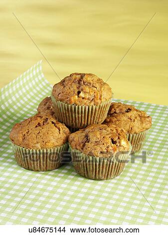 Picture - Five Carrot Muffins On Green Gingham Cloth. Fotosearch