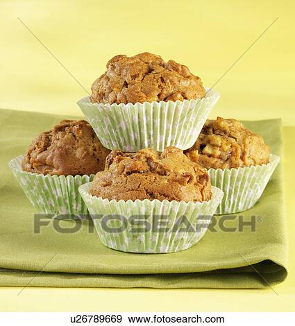 Stock Photo - Five Carrot Muffins On Green Gingham Cloth. Fotosearch