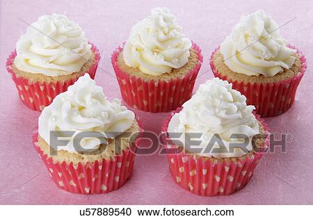 Five Cupcakes In Pink And White Polka Dot Cases, Topped With Piped Buttercream And Decorated With Small Pearls, On Pink View Large Photo Image Stock Image - Five Cupcakes In Pink And White Polka Dot Cases, Topped With Piped Buttercream And Decorated With Small Pearls, On Pink. Fotosearch
