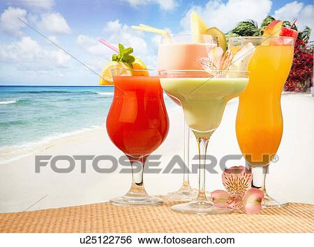 Four Tropical Fruit Juice Cocktails On Sandy Palm Fringed Caribbean Beach View Large Photo Image Stock Photograph - Four Tropical Fruit Juice Cocktails On Sandy Palm Fringed Caribbean Beach. Fotosearch