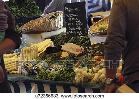 Stock Image - French market stall selling vegetables. Fotosearch