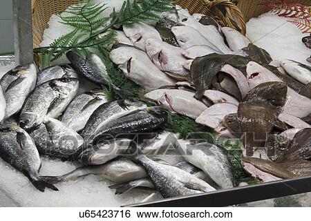Stock Photograph - Fresh fish on a bed of ice Versailles market. Fotosearch