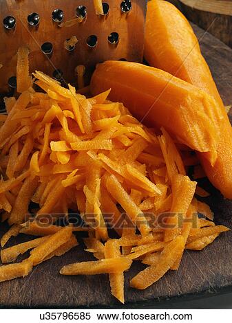 Fresh raw grated carrots with a metal grater View Large Photo Image Stock Photography - Fresh raw grated carrots with a metal grater. Fotosearch