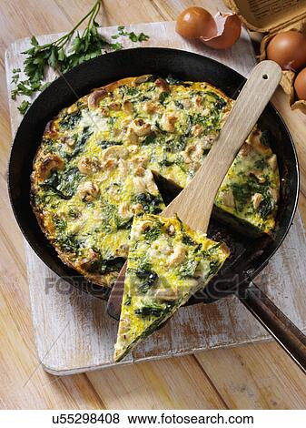Frittata with mushrooms spinach onions and cashews View Large Photo Image Stock Photo - Frittata with mushrooms spinach onions and cashews. Fotosearch